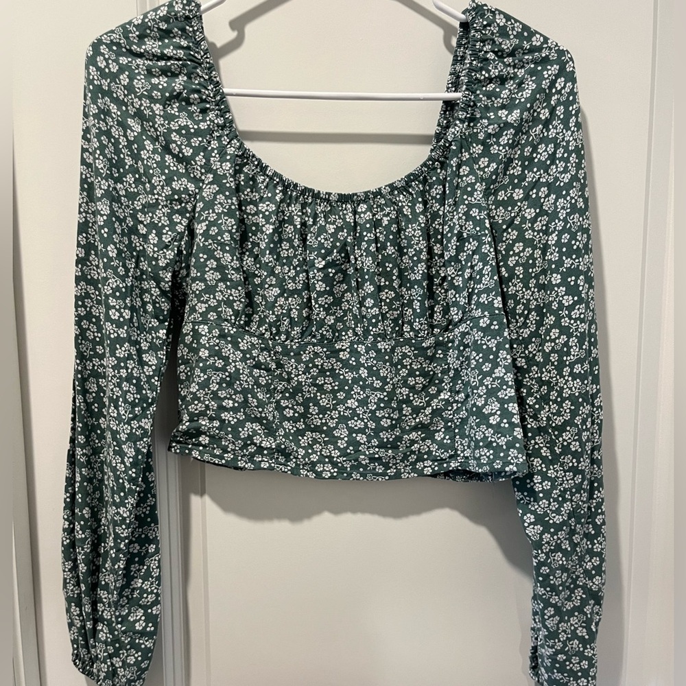 Green and white floral blouse